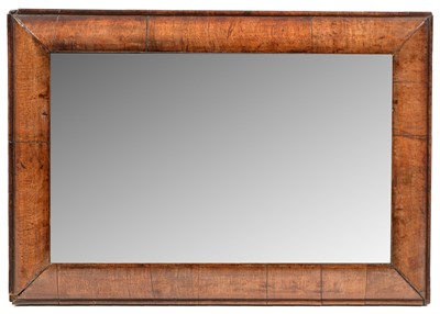 Lot 1089 - A 19th Century walnut cushion framed mirror