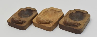 Lot 977 - Three Robert Thompson ashtrays