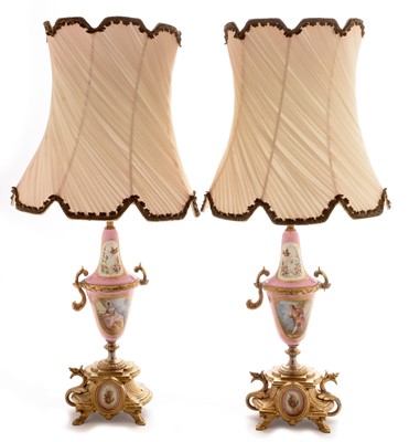 Lot 968 - A pair of Sevres style gilt metal table lamps.