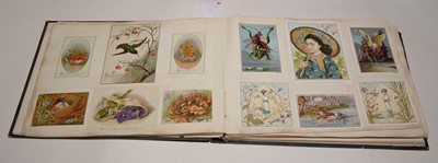 Lot 551 - Two albums of Victorian postcards.