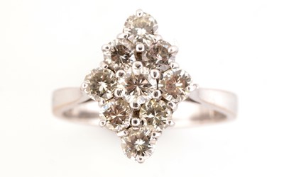 Lot 11 - A nine stone diamond ring
