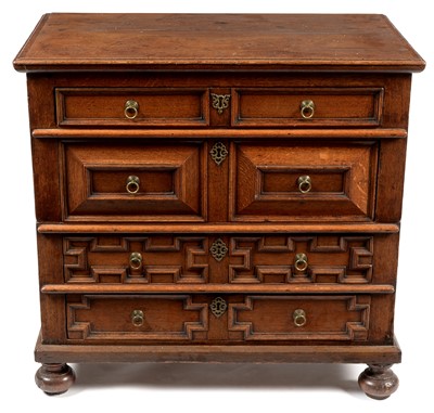 Lot 765 - 17th Century oak geometric front split chest of drawers