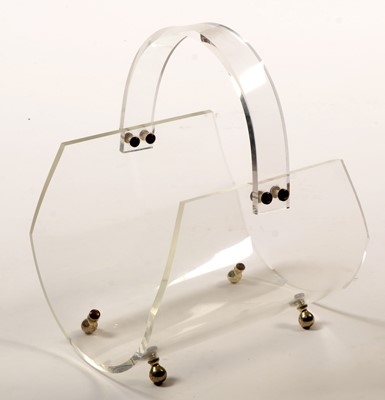 Lot 1143 - A French Lucite magazine holder.