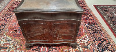 Lot 742 - George III style mahogany serpentine pedestal desk