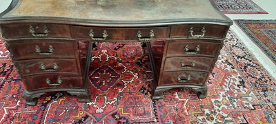 Lot 742 - George III style mahogany serpentine pedestal desk