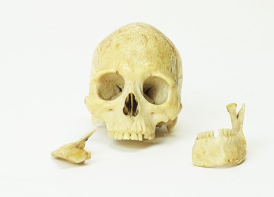 Lot 817 - A rare carved bone skull