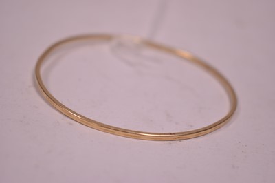 Lot 21 - A yellow metal bangle