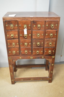 Lot 635 - An Asian hardwood spice chest.