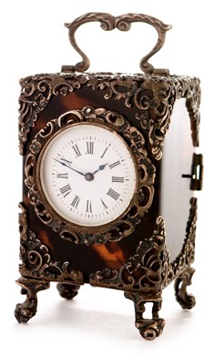 Lot 269 - Silver mounted tortoiseshell dressing table timepiece