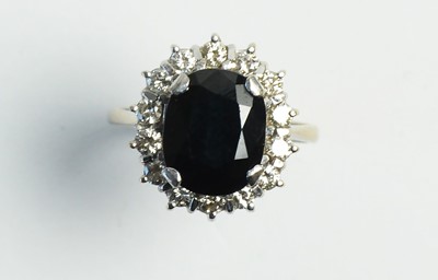 Lot 36 - Sapphire and diamond cluster ring