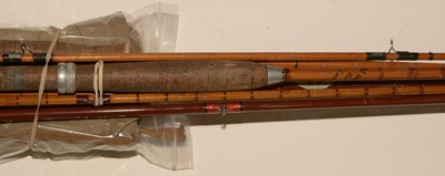Lot 748 - Three fishing rods.