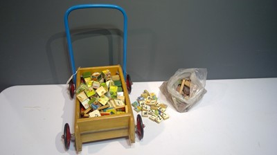 Lot 1143 - Tri-ang baby walker and building blocks.