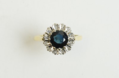 Lot 42 - A sapphire and diamond cluster ring