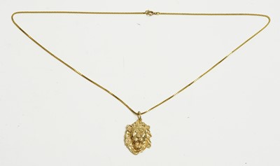 Lot 18 - Gold lion pattern pendant and chain