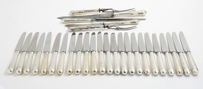 Lot 149 - Twenty-four table knives and a carving set
