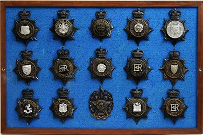 Lot 810 - A collection of Police helmet badges, framed.
