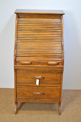 Lot 488 - Early 20th C narrow oak roll-top desk.
