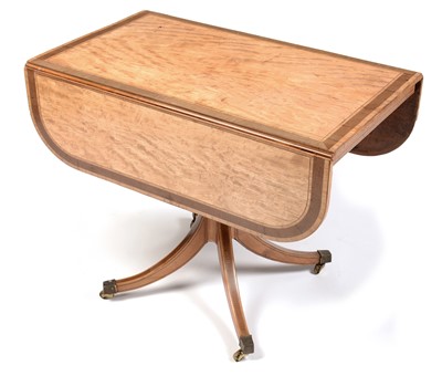 Lot 894 - A late George III satinwood and banded drop-leaf table.