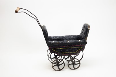 Lot 1107 - A Victorian black dolls pram