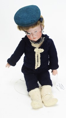 Lot 1027 - Kamer & Reinhart, Germany: a bisque head boy doll 'Peter'.