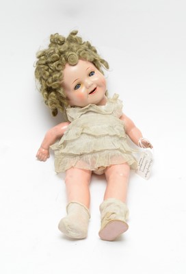 Lot 1040 - A mid 20th C German "Shirley Temple" doll; and two baby dolls by Pedigree and Minerva.