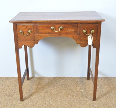 Lot 437 - A Georgian mahogany lowboy, with rectangular...