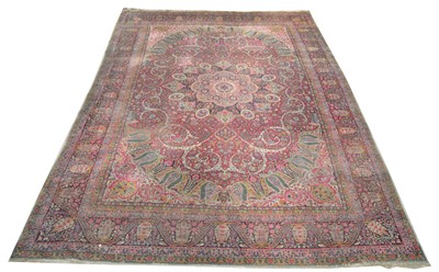 Lot 322 - A Kirman carpet.