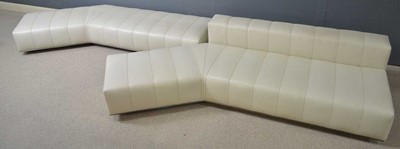 Lot 62 - Attributed to Minotti: two cream leather angular seating units.