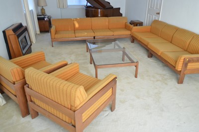 Lot 127 - A 1960's teak and Harris Tweed modular lounge suite.