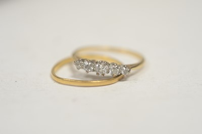 Lot 9 - A five stone diamond ring; and a wedding band.