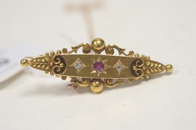 Lot 20 - An Edwardian ruby and diamond set brooch.