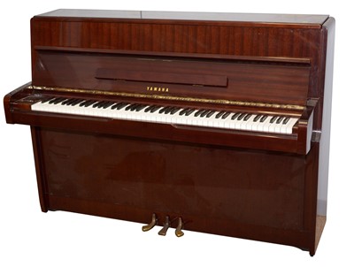 Lot 119 - Yamaha upright grand piano.