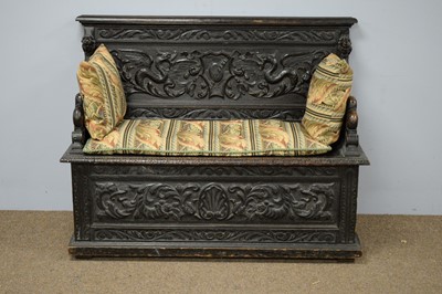 Lot 52 - Late Victorian oak hall seat.