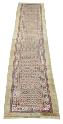 Lot 634 - An antique Caucasian runner.