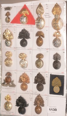 Lot 1130 - A collection of 19 Fusilier Regiment cap badges.