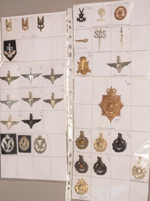 Lot 1136 - A collection of 31 Special Forces cap badges.