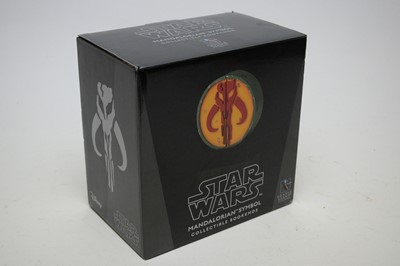 Lot 1003 - Star Wars Gentle Giant Mandalorian Symbol bookends