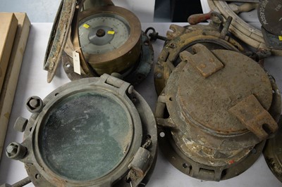 Lot 290 - A brass cased ship's compass on a gimble and eight portholes.