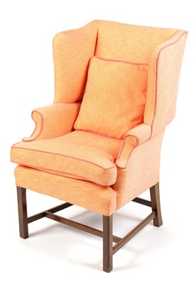 Lot 852 - A Georgian style wingback armchair
