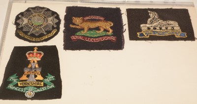Lot 1251 - A collection of approximately 50 Military cloth badges and Regimental embroideries.