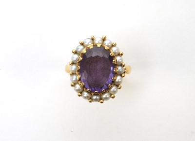Lot 56 - A synthetic colour change sapphire and cultured pearl cluster ring.