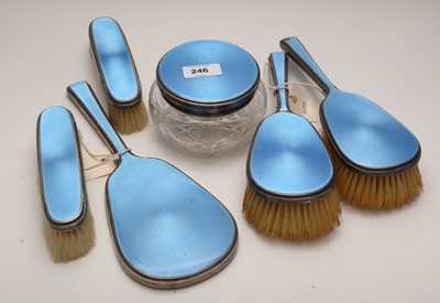 Lot 246 - Silver-mounted blue guilloche enamel dressing table set.