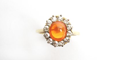 Lot 69 - A fire opal and diamond cluster ring