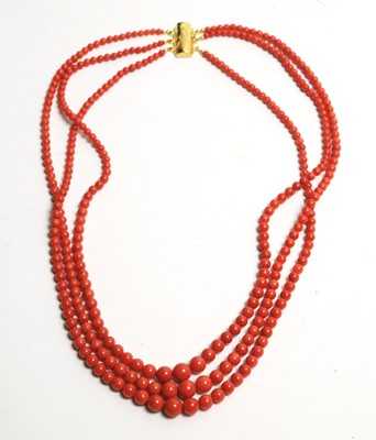 Lot 30 - A three row coral bead necklace