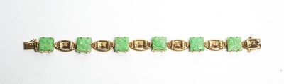 Lot 32 - Carved jade and 9ct yellow gold bracelet