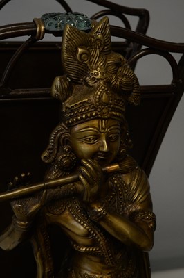 Lot 218 - Repro Indian brass deity; magazine rack; and Asian stand.