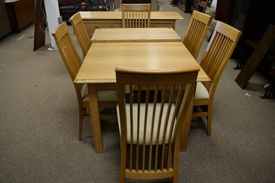 Lot 70 - 20th C light oak dining room suite.