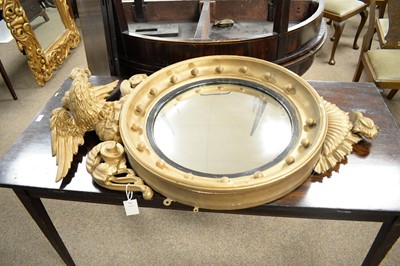 Lot 28 - A 20th Century reproduction convex wall mirror; together with another