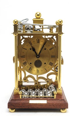 Lot 771 - A modern lacquered brass spherical weight clock.