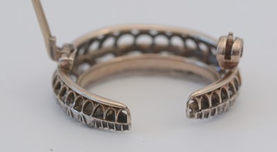 Lot 1 - A diamond crescent brooch.